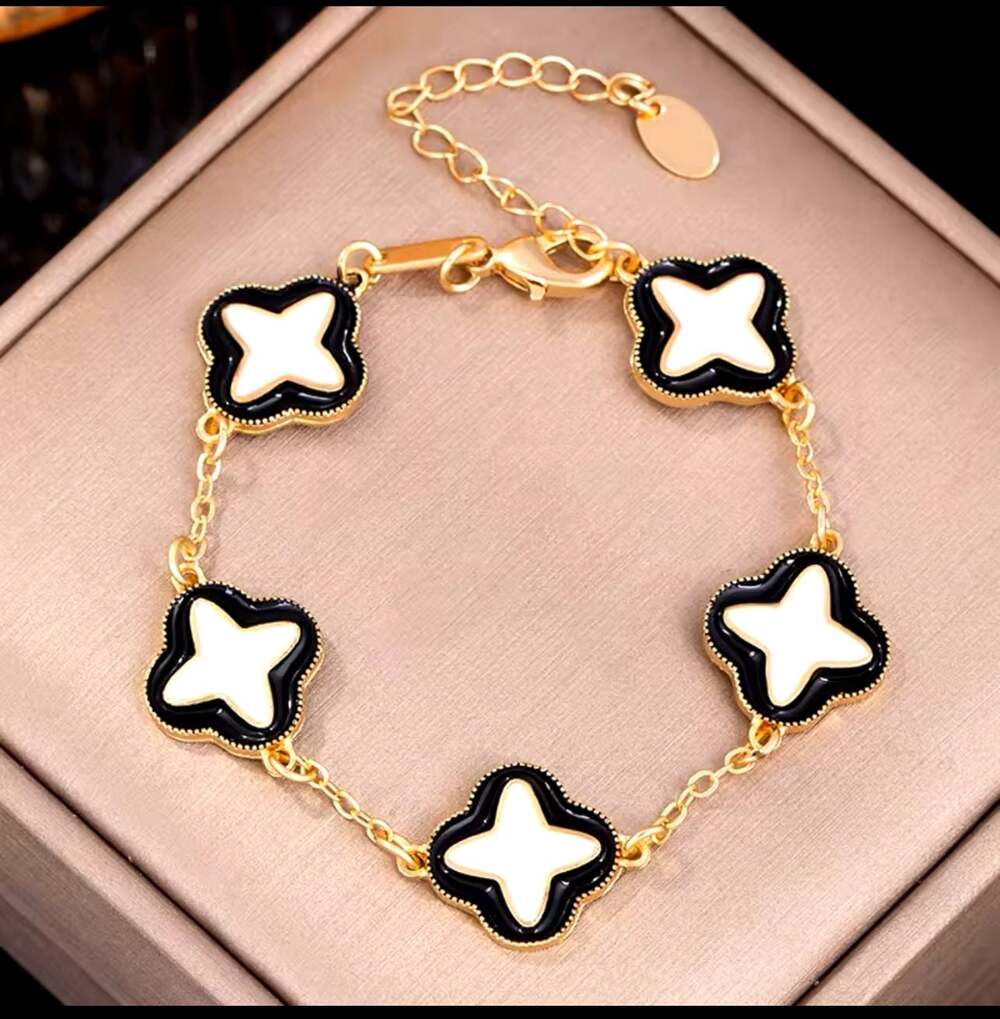 Gold-Tone Clover Motif Bracelet with Black and White Enamel